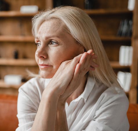 white-hair-woman-contemplating-iStock-1352067809-crop@477x452